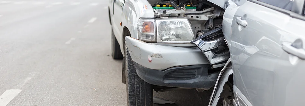 Modern car accident involving two cars on the road