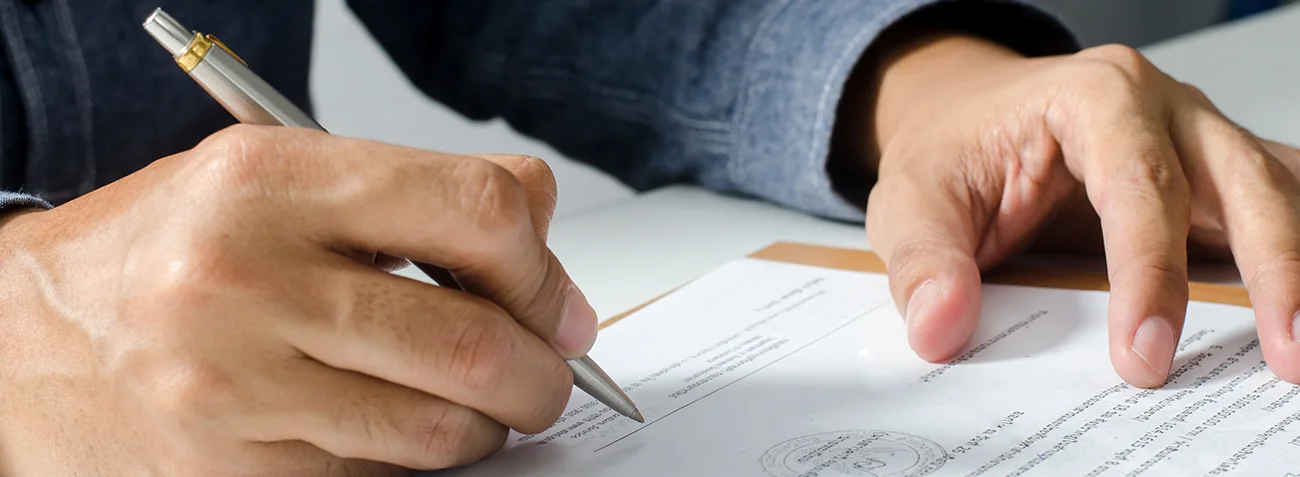Man signing a document