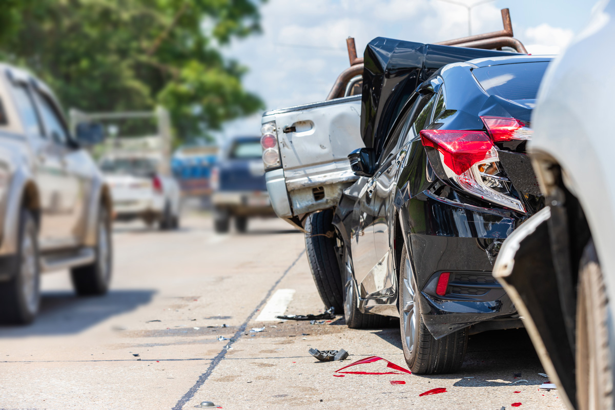 A car accident between a black car and a silver car in El Paso.