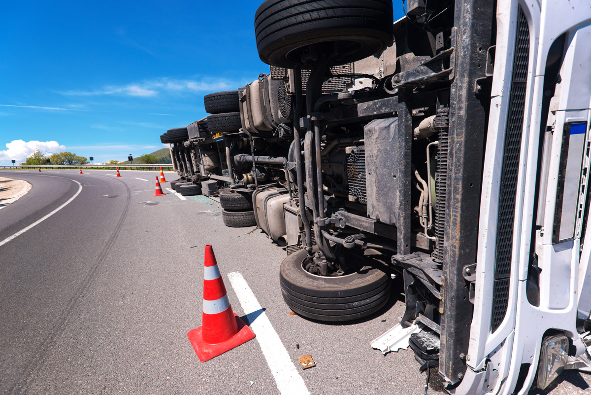 A truck on its side in the road in El Paso.