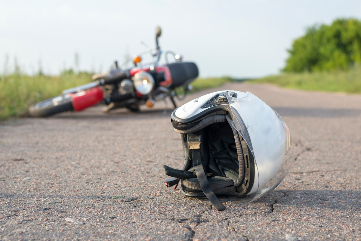A motorcycle and helmet on a road in El Paso.