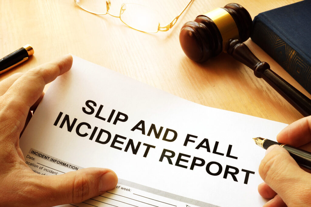 A white piece of paper reading “SLIP AND FALL INCIDENT REPORT” in black in El Paso.