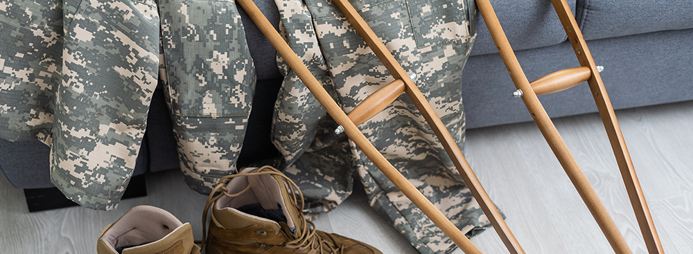 Military uniform with crutches, disability