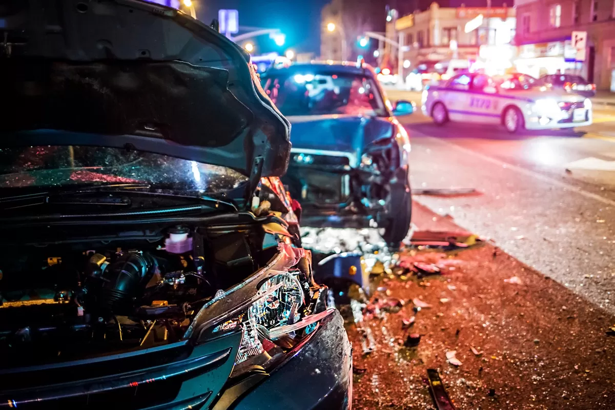 Two cars involved in a car accident with a police car behind them in Missouri City.